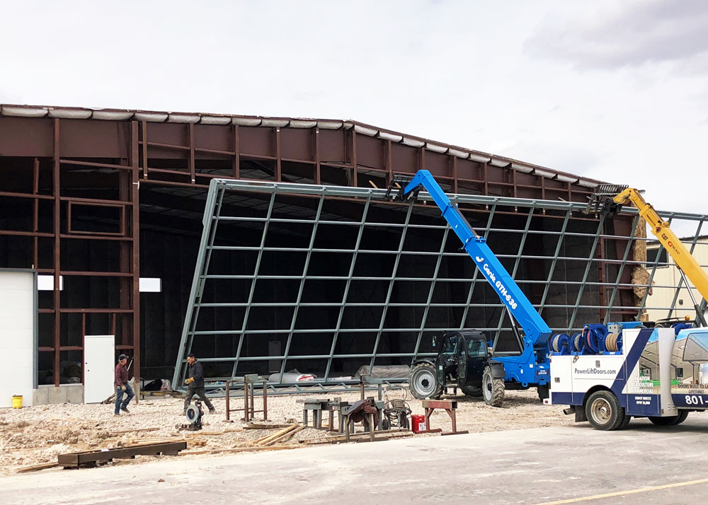 red steel framing with a large metal grid panel