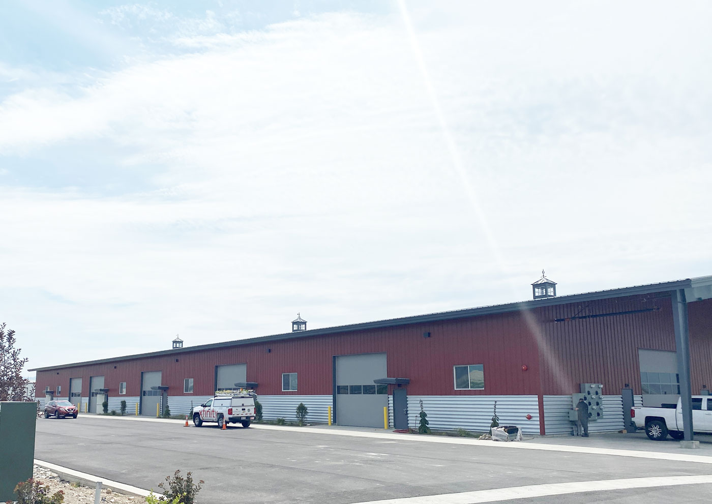 a red and gray industrial steel building