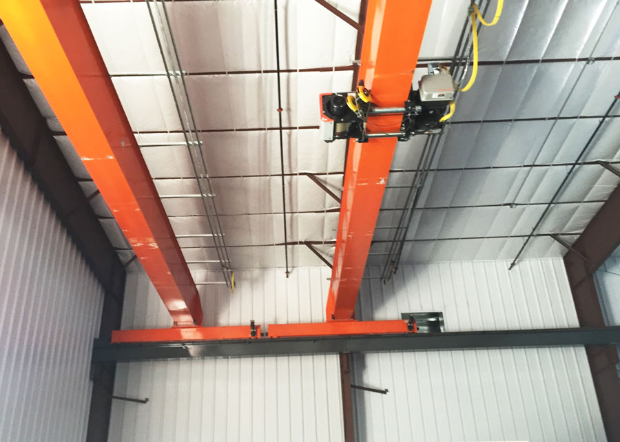 two cranes in the industrial steel building