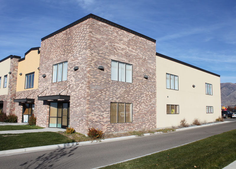 a steel building with brick and stucco exterior walls