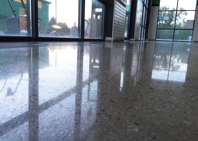 gray polished concrete floor with glass windows