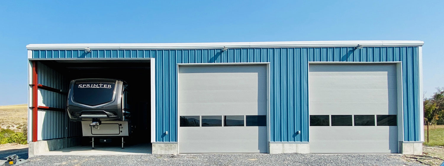 a blue car garage with an RV