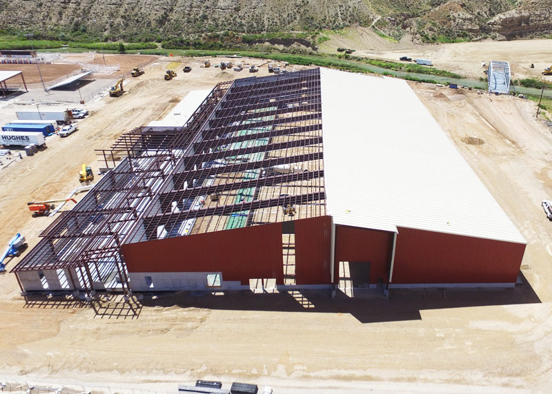 a red steel building under construction
