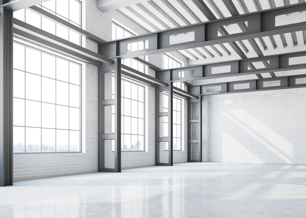an interior of a steel building with white wall