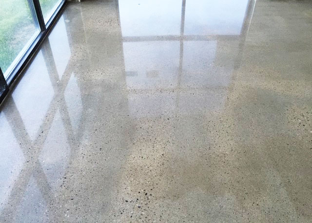 a gray polished concrete floor