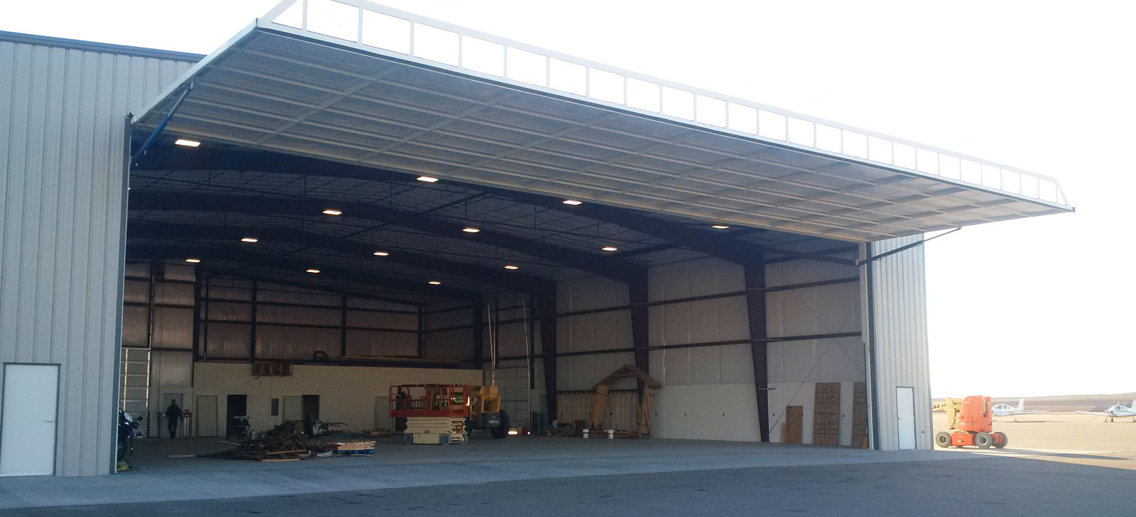 an agricultural storage steel building with a large white door