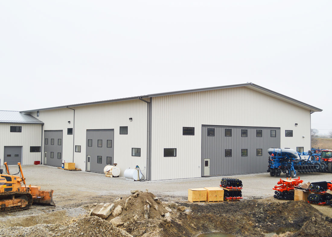 a large workshop with a gray doors